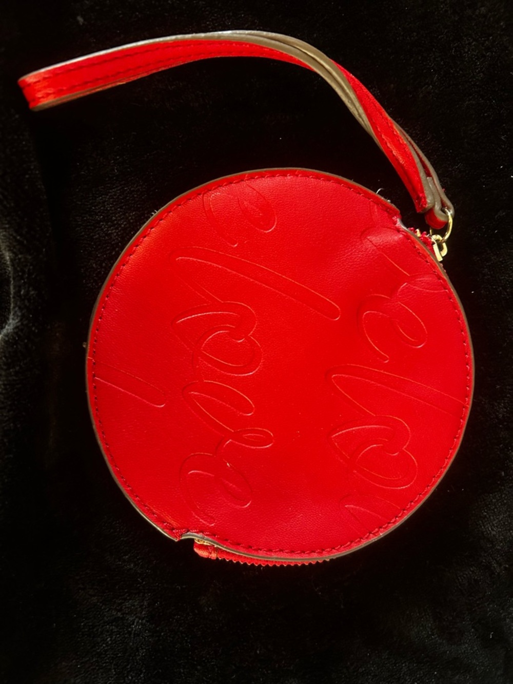 New York & Company Red Round Wristlet with Embossed Script